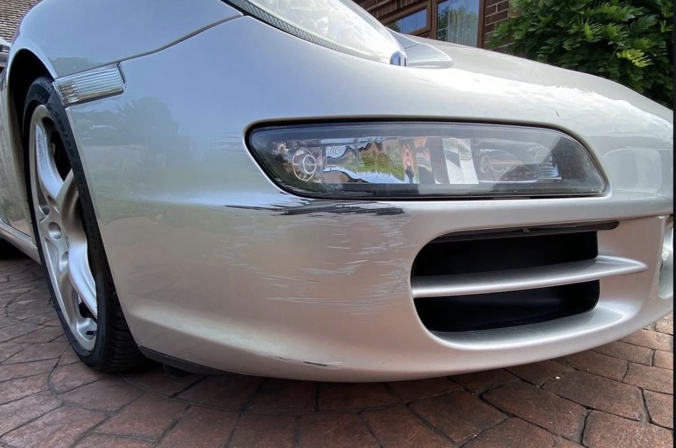 Porsche 911 front bumper scrape and scuff before repair — Technicolour Smart Repair, Ascot