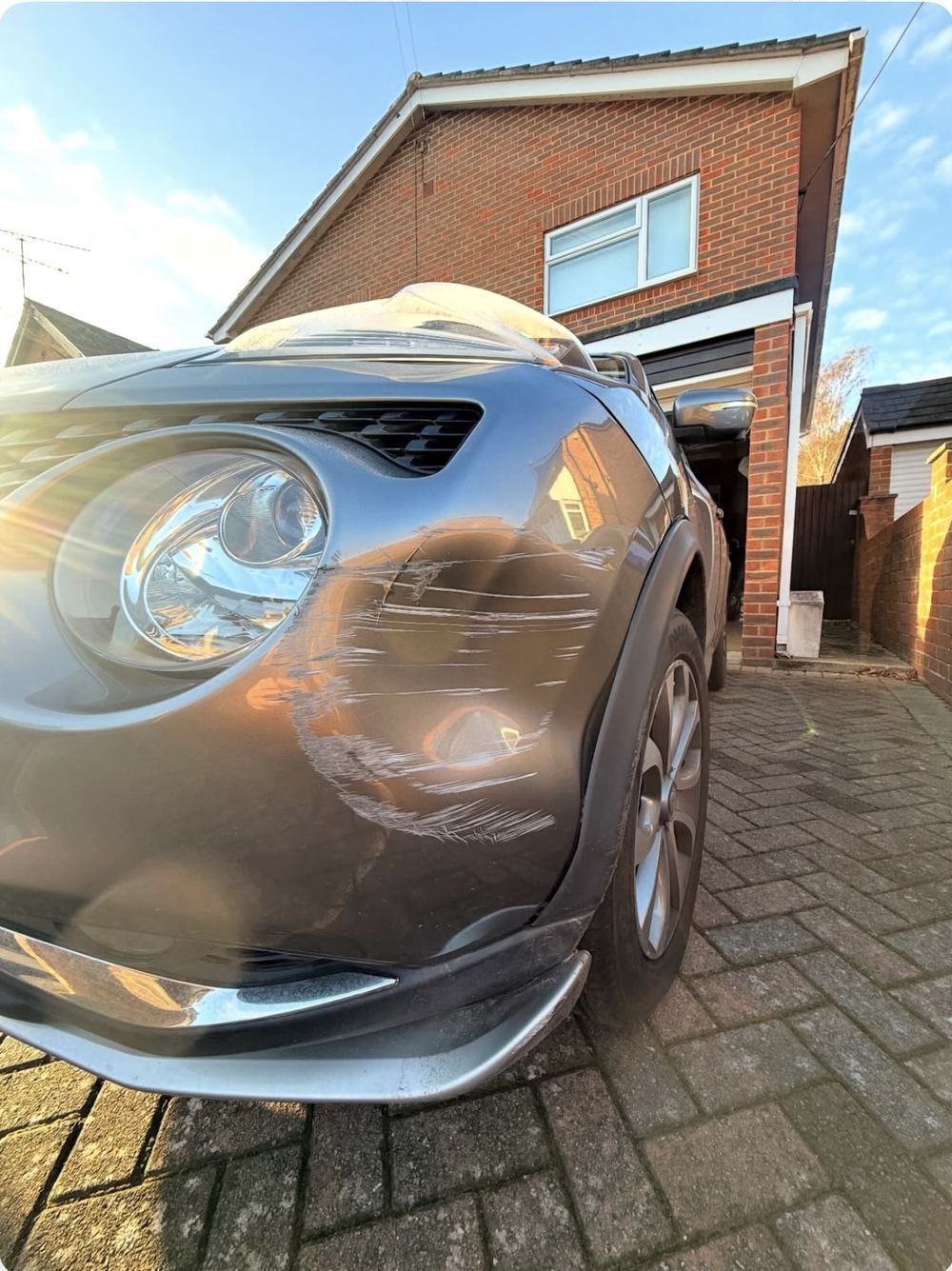 Nissan Juke front bumper scrape before repair, Fleet area